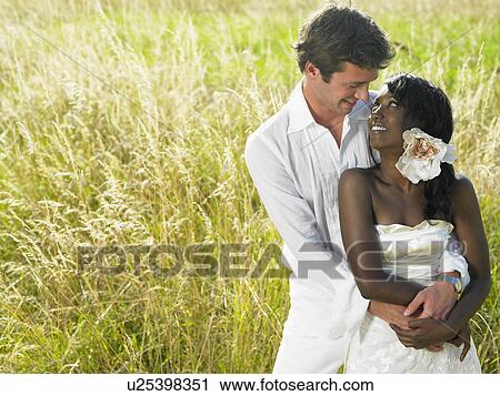Married couple in a field View Large Photo Image Stock Image - Married couple in a field. Fotosearch
