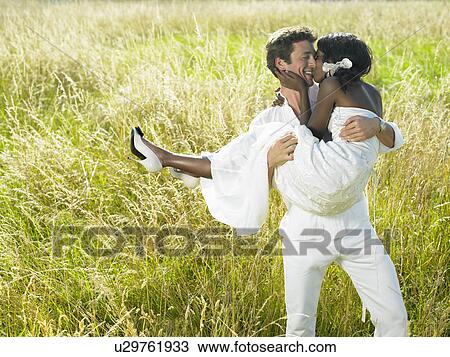 Married couple in a field View Large Photo Image Stock Image - Married couple in a field. Fotosearch