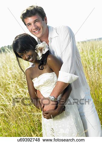 Stock Photo - Married couple in a field. Fotosearch