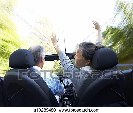 Mature couple driving sports car View Large Photo Image Stock Image - Mature couple driving sports car. Fotosearch