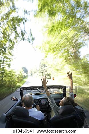 Mature couple driving sports car View Large Photo Image Stock Image - Mature couple driving sports car. Fotosearch