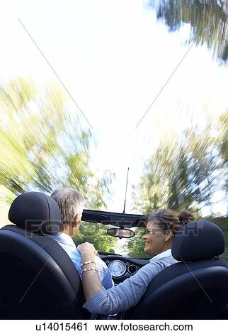 Mature couple driving sports car View Large Photo Image Stock Image - Mature couple driving sports car. Fotosearch