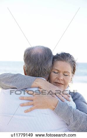 Mature couple hugging each other View Large Photo Image Stock Photo - Mature couple hugging each other. Fotosearch