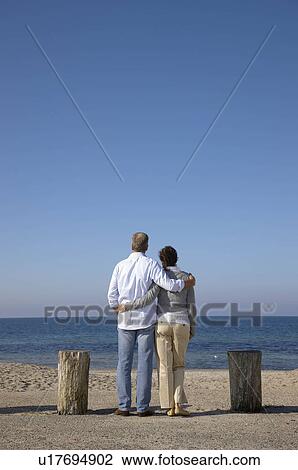 Mature couple looking at sea view View Large Photo Image Stock Image - Mature couple looking at sea view. Fotosearch