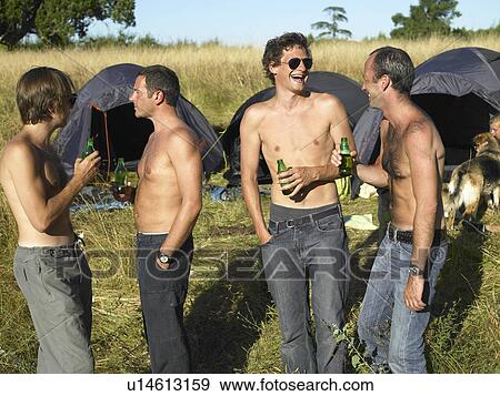 Men drinking beer at a festival View Large Photo Image Stock Photo - Men drinking beer at a festival. Fotosearch