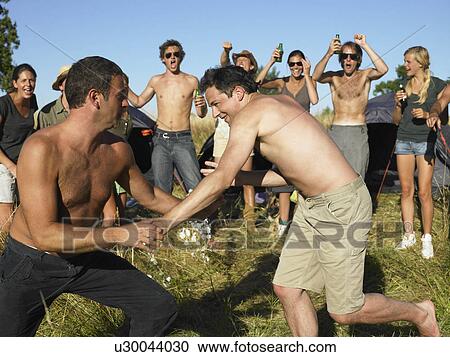 Stock Image - "Men fighting, supporting crowd". Fotosearch