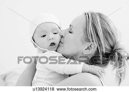 Mom holding her baby View Large Photo Image Stock Photo - Mom holding her baby. Fotosearch