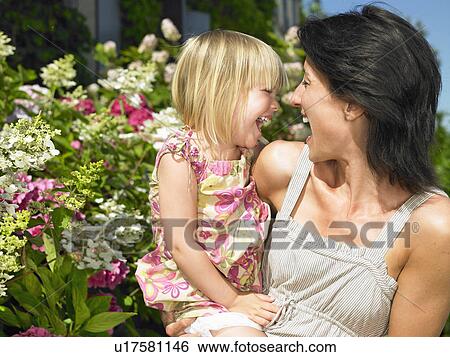 Mother and daughter having a good laugh View Large Photo Image Stock Photograph - Mother and daughter having a good laugh. Fotosearch