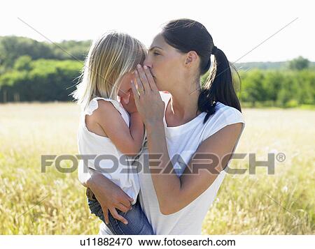 Mother and daughter in a field View Large Photo Image Stock Image - Mother and daughter in a field. Fotosearch