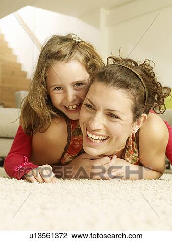 Mother and daughter laughing View Large Photo Image Stock Image - Mother and daughter laughing. Fotosearch
