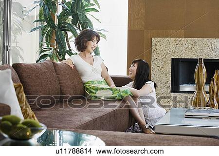 Picture - Mother and daughter laughing together. Fotosearch