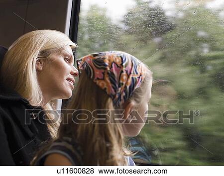 Mother and daughter on a train View Large Photo Image Stock Photo - Mother and daughter on a train. Fotosearch