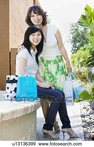Mother and daughter shopping View Large Photo Image Stock Photo - Mother and daughter shopping. Fotosearch