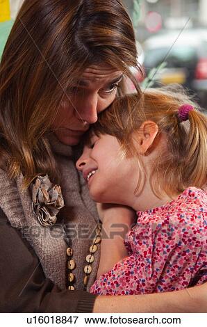 Mother comforting daughter View Large Photo Image Stock Photo - Mother comforting daughter. Fotosearch