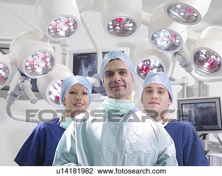 Nurses and surgeon in operating theatre View Large Photo Image Stock Image - Nurses and surgeon in operating theatre. Fotosearch