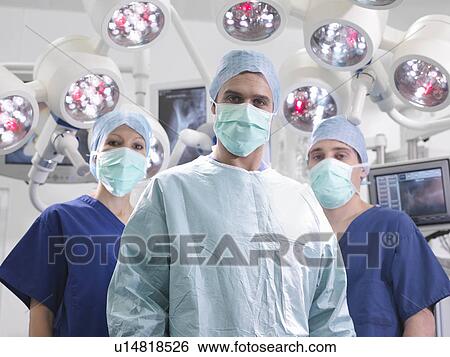 Stock Photograph - Nurses and surgeon in operating theatre. Fotosearch
