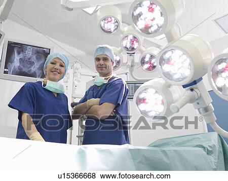 Stock Photo - Nurses in operating theatre. Fotosearch