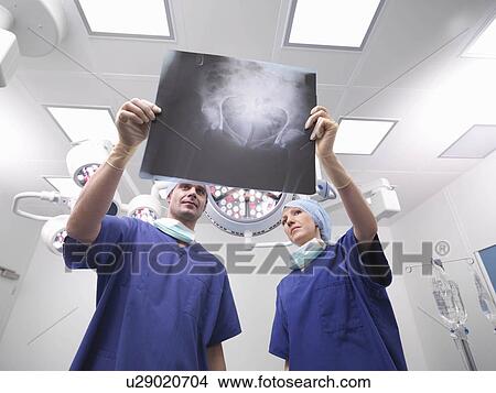 Nurses looking at x-ray View Large Photo Image Picture - Nurses looking at x-ray. Fotosearch