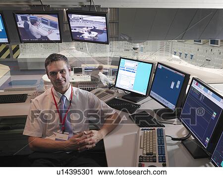 Stock Image - Operator in control room. Fotosearch
