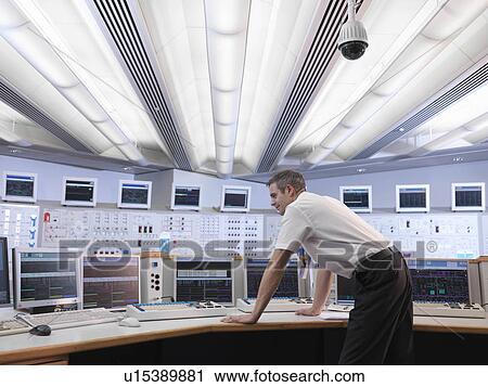 Stock Image - Operator in control room. Fotosearch