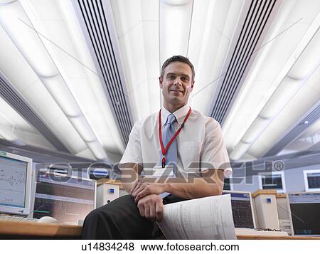 Operator in control room View Large Photo Image Stock Photo - Operator in control room. Fotosearch