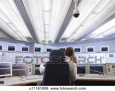 Stock Photograph - Operator in control room. Fotosearch