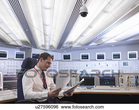 Stock Photograph - Operator in control room. Fotosearch