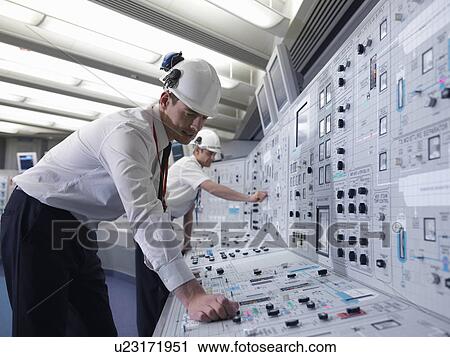 Stock Image - Operators with safety helmets. Fotosearch