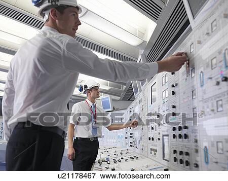 Stock Photo - Operators with safety helmets. Fotosearch