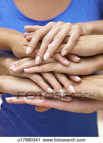 Pairs of hands on top of each others View Large Photo Image Stock Image - Pairs of hands on top of each others. Fotosearch