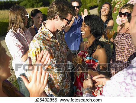 Stock Photography - "People at a cocktail party, sunset". Fotosearch