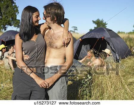Stock Photo - "People at a festival, backpacking tents". Fotosearch