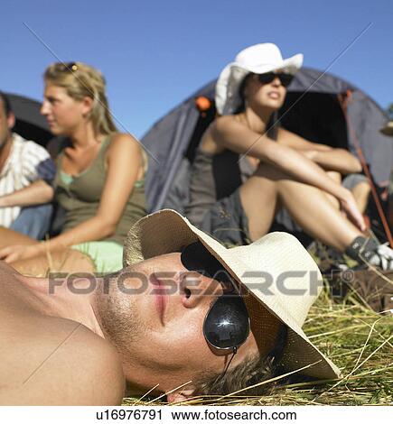 "People in a field, backpacking tents" View Large Photo Image Stock Image - "People in a field, backpacking tents". Fotosearch