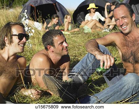 Stock Photo - "People in a field, backpacking tents". Fotosearch