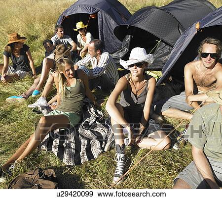 Stock Photo - "People in a field, backpacking tents". Fotosearch