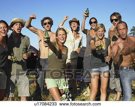 "People in a field, raising their beer" View Large Photo Image Stock Image - "People in a field, raising their beer". Fotosearch