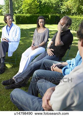 Stock Image - "People in rehab, outdoors". Fotosearch