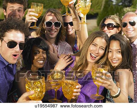 People toasting their glasses View Large Photo Image Stock Photo - People toasting their glasses. Fotosearch