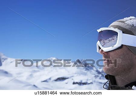 Picture - Portrait of man wearing ski goggles. Fotosearch