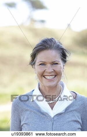 Portrait of mature beauty in nature View Large Photo Image Stock Image - Portrait of mature beauty in nature. Fotosearch