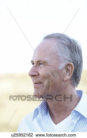 Stock Image - Portrait of mature man in nature. Fotosearch