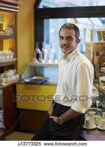Portrait of waiter in cafe View Large Photo Image Stock Photography - Portrait of waiter in cafe. Fotosearch