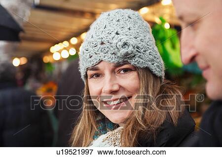 Stock Photo - Portrait of woman at outdoor market. Fotosearch