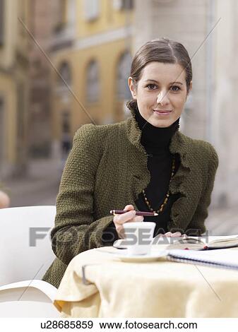 Portrait of young woman in piazza View Large Photo Image Stock Photo - Portrait of young woman in piazza. Fotosearch