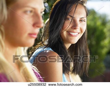 "Portraits of women, one smiling" View Large Photo Image Stock Image - "Portraits of women, one smiling". Fotosearch