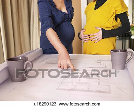 Stock Image - Pregnant women at work. Fotosearch