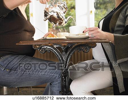 Pregnant women having tea View Large Photo Image Stock Image - Pregnant women having tea. Fotosearch