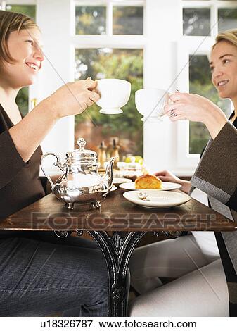 Stock Photo - Pregnant women having tea. Fotosearch