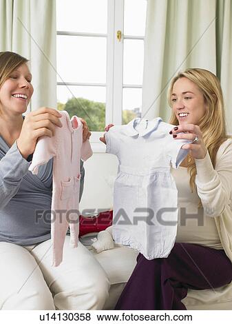 Stock Photo - Pregnant women in nursery. Fotosearch