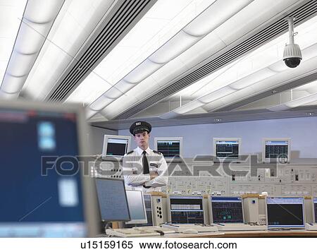 Stock Photography - Security guard in control room. Fotosearch
